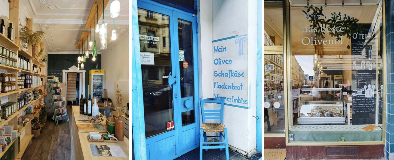 © Oterra | LaGrece | Feinkost in Wien Bild eines kleinen Lebensmittelgeschäfts mit Wein, Oliven, Schafkäse, Fladenbrot und warmen Imbissen. Schönes Interieur und blaue Außentür.