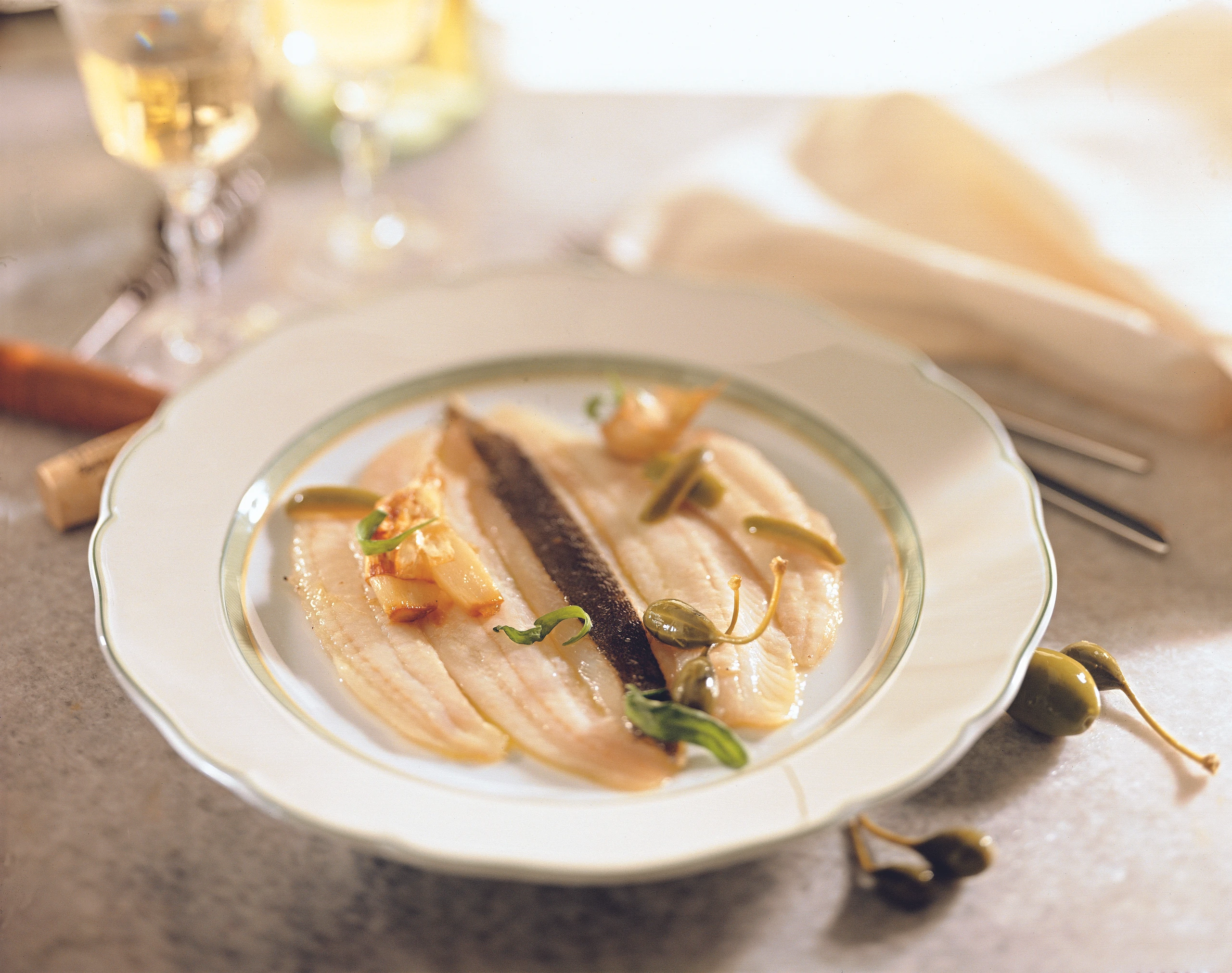 Schollenfilets mit grünen Oliven