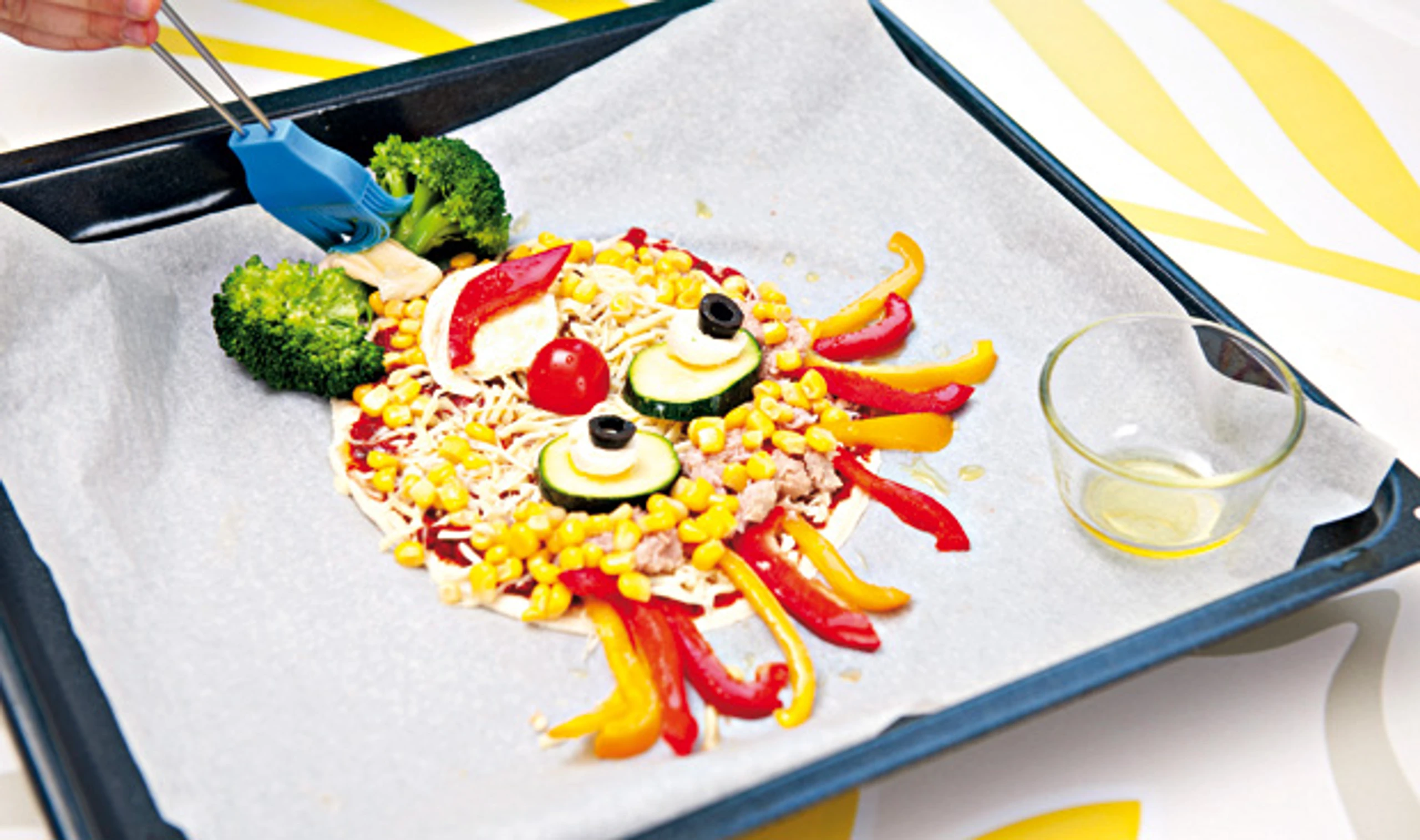 Clown-Pizza mit Thunfisch und Gemüse