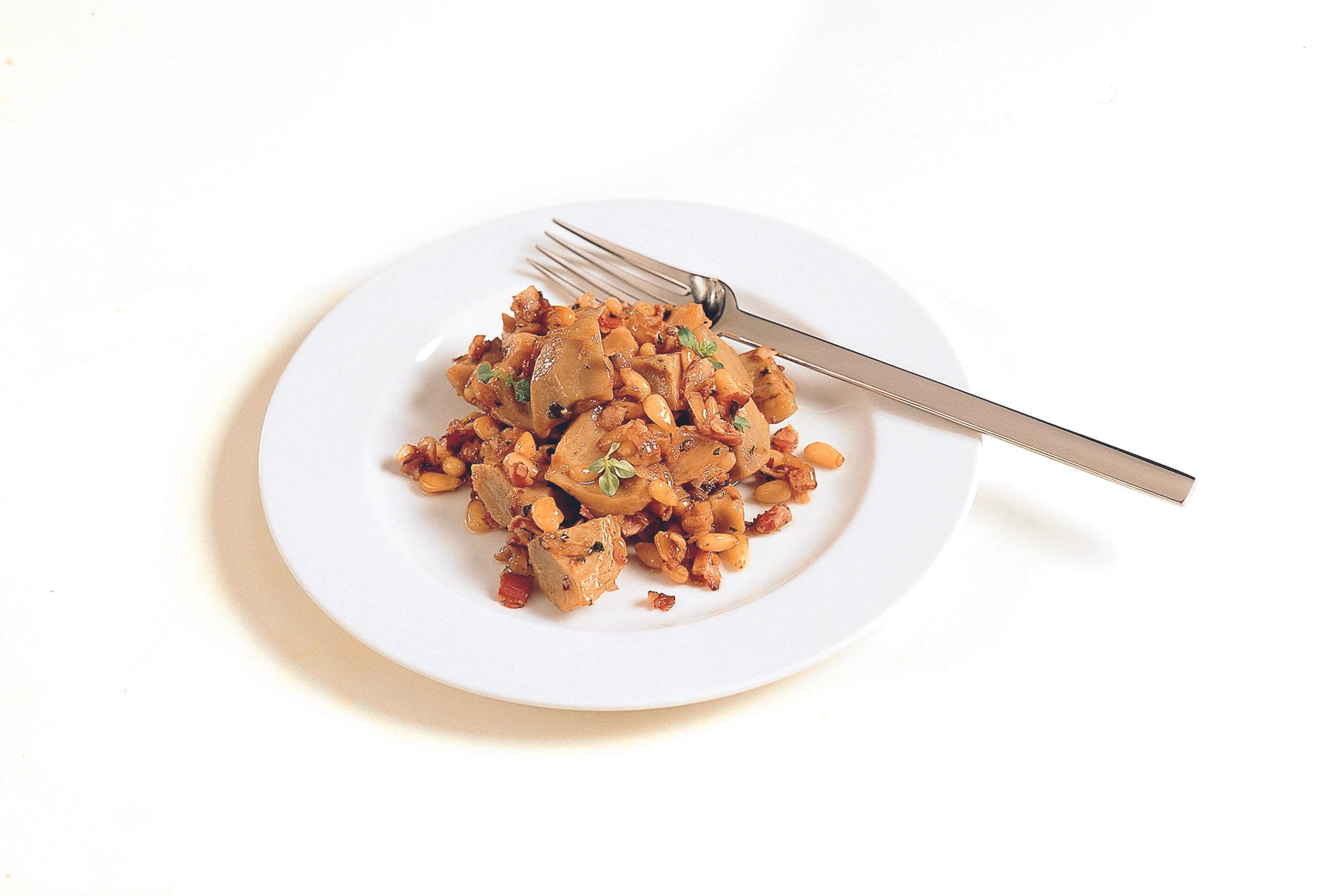 Pikante Artischockenböden mit Speck und Pinienkernen