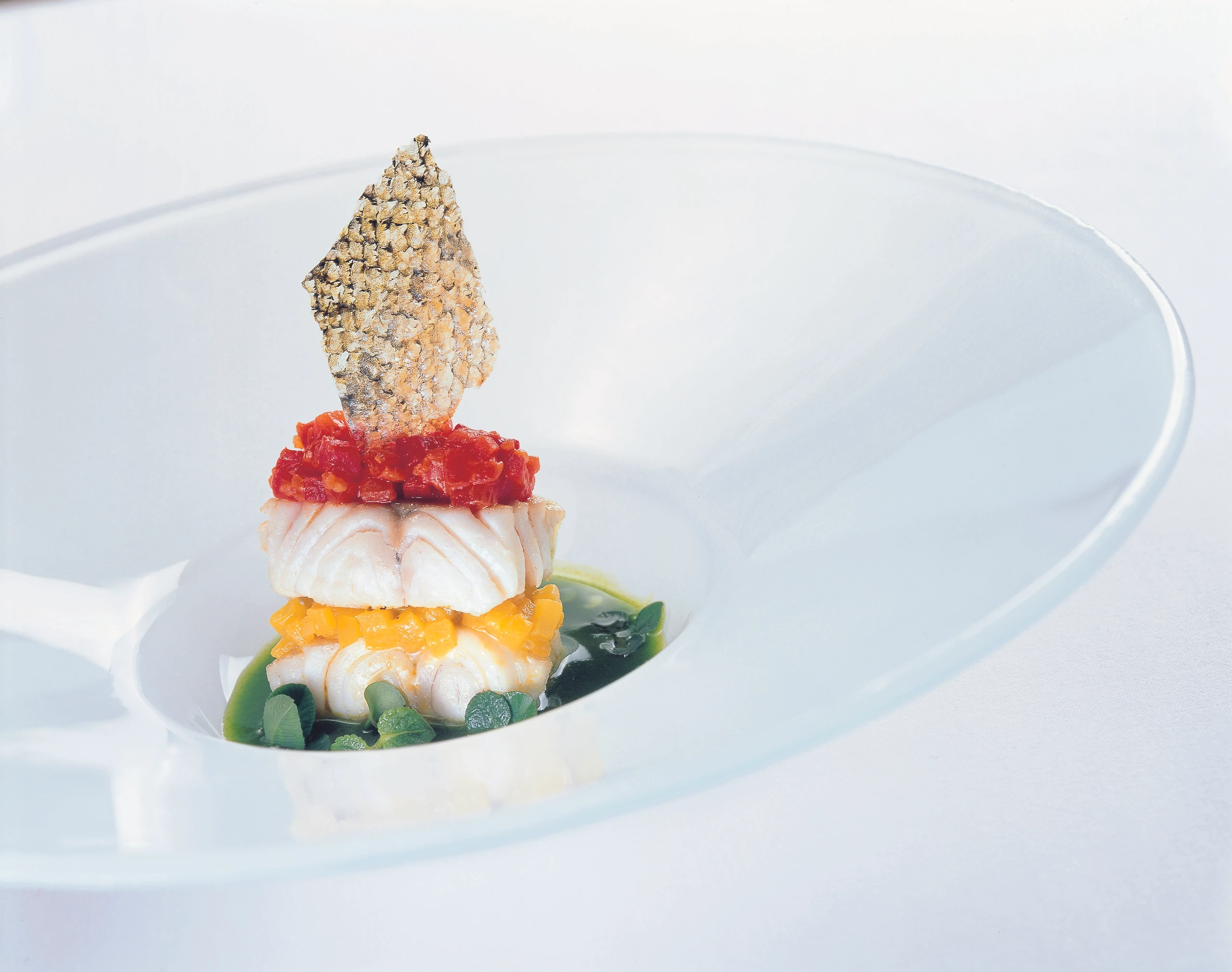 Mille feuilles von Zander und Paprika im Rotklee-Kräuter-Fond