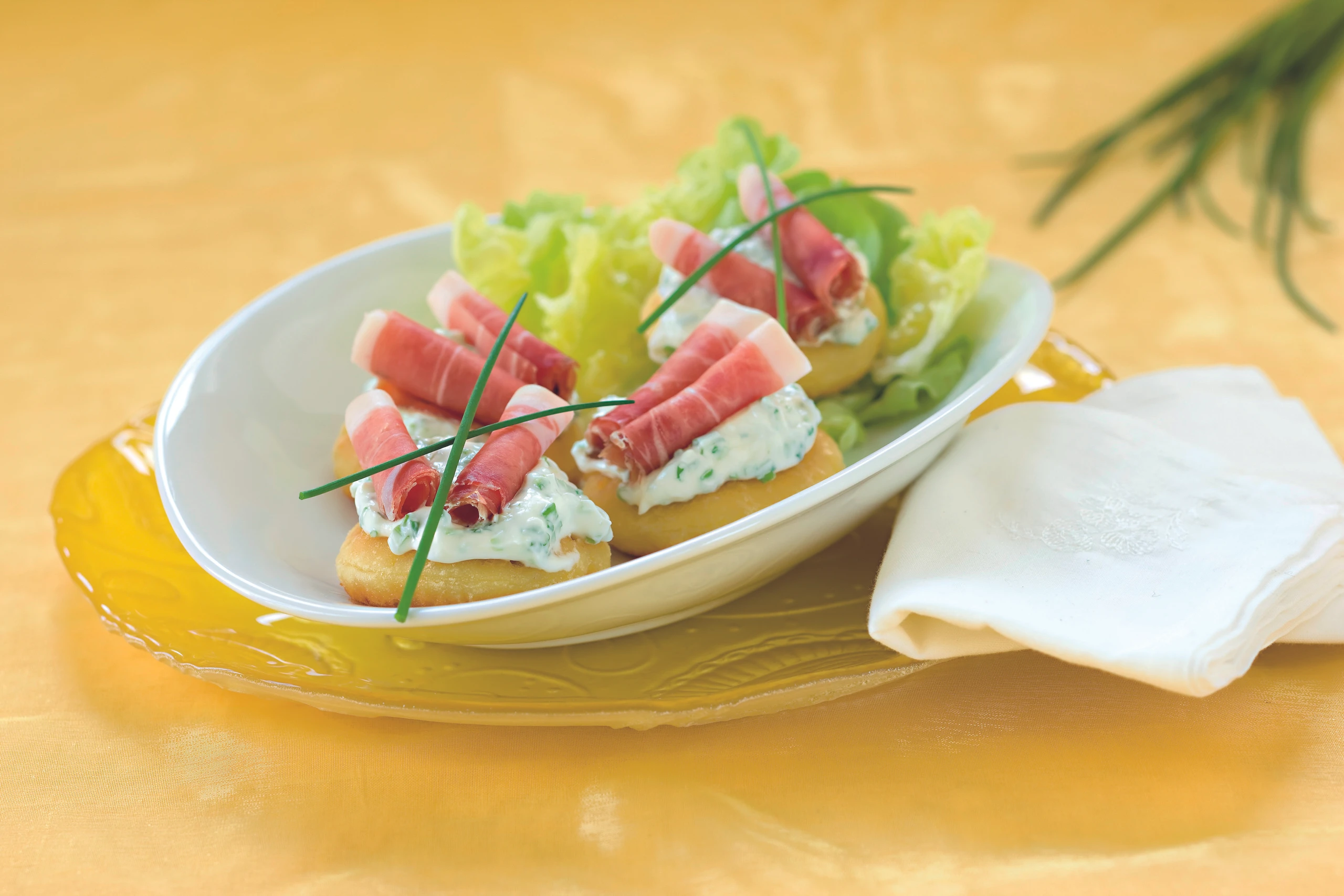 Erdäpfelkrapferl mit Rohschinken