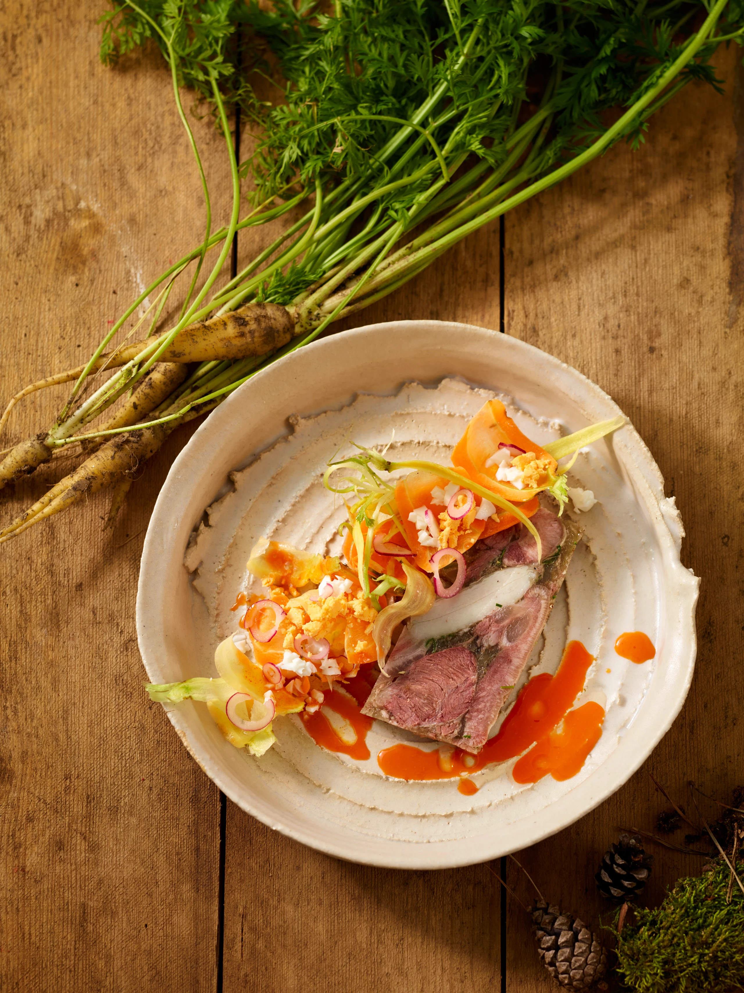 Wildschweinsulz mit Sanddorn-Vinaigrette