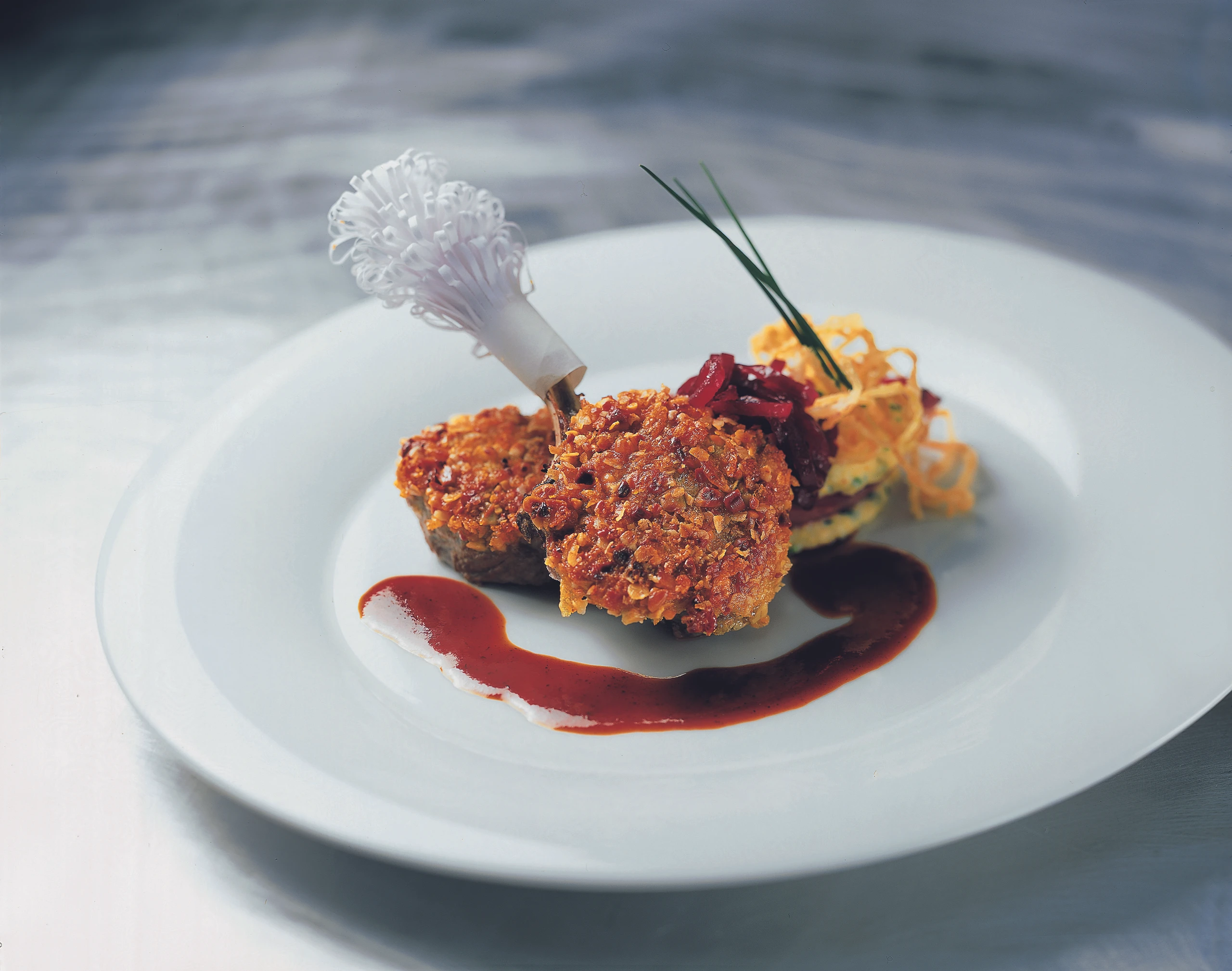 Schnitzerl vom Lamm in Müslihülle mit Polenta