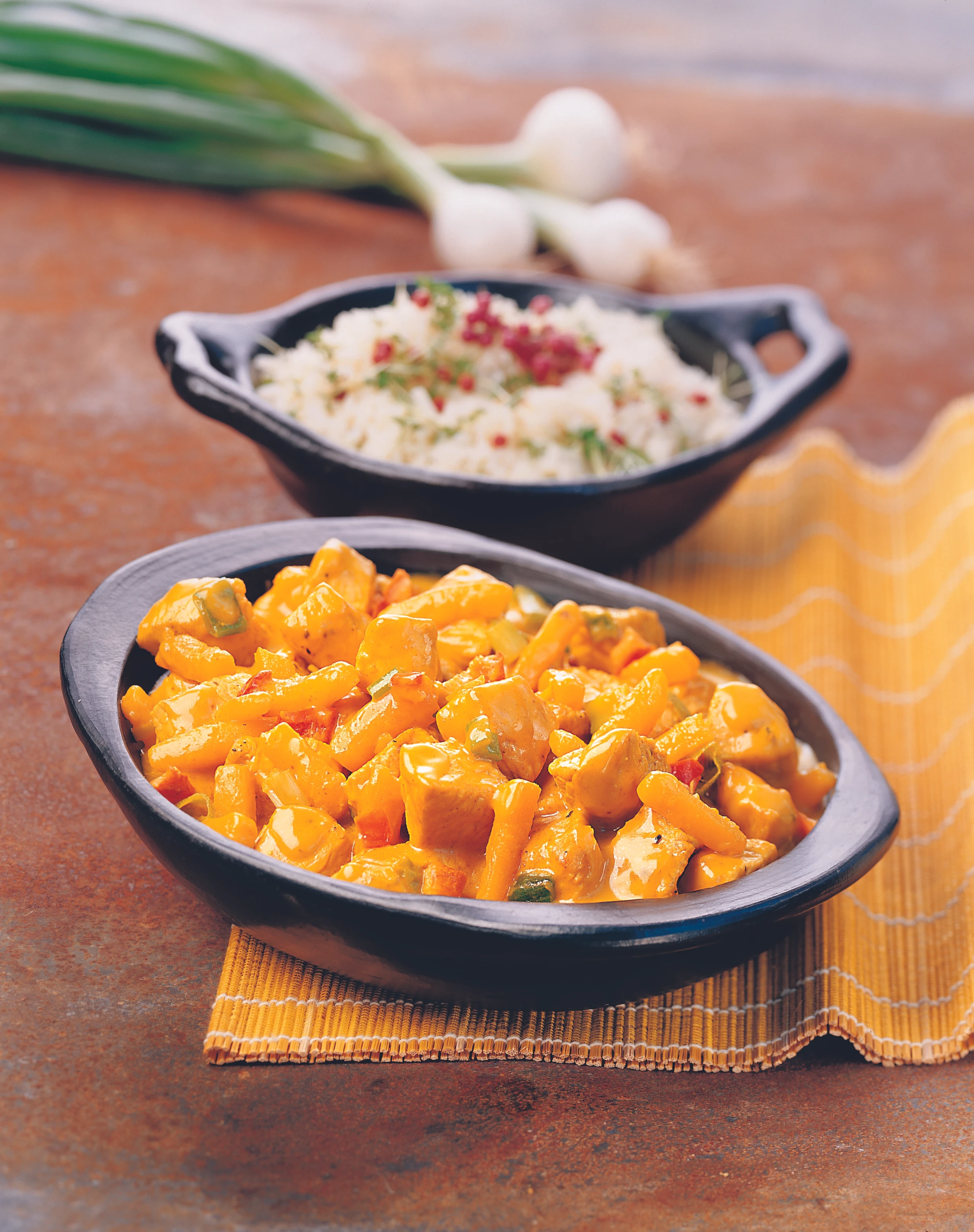 Putencurry mit Kürbis und Jungzwiebeln