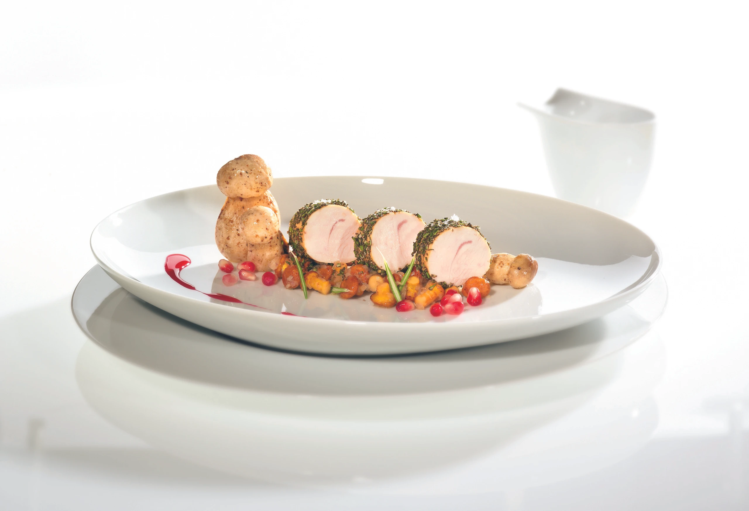 Truthahnfilet in der Rosmarinkruste mit Pilzen und Granatapfel