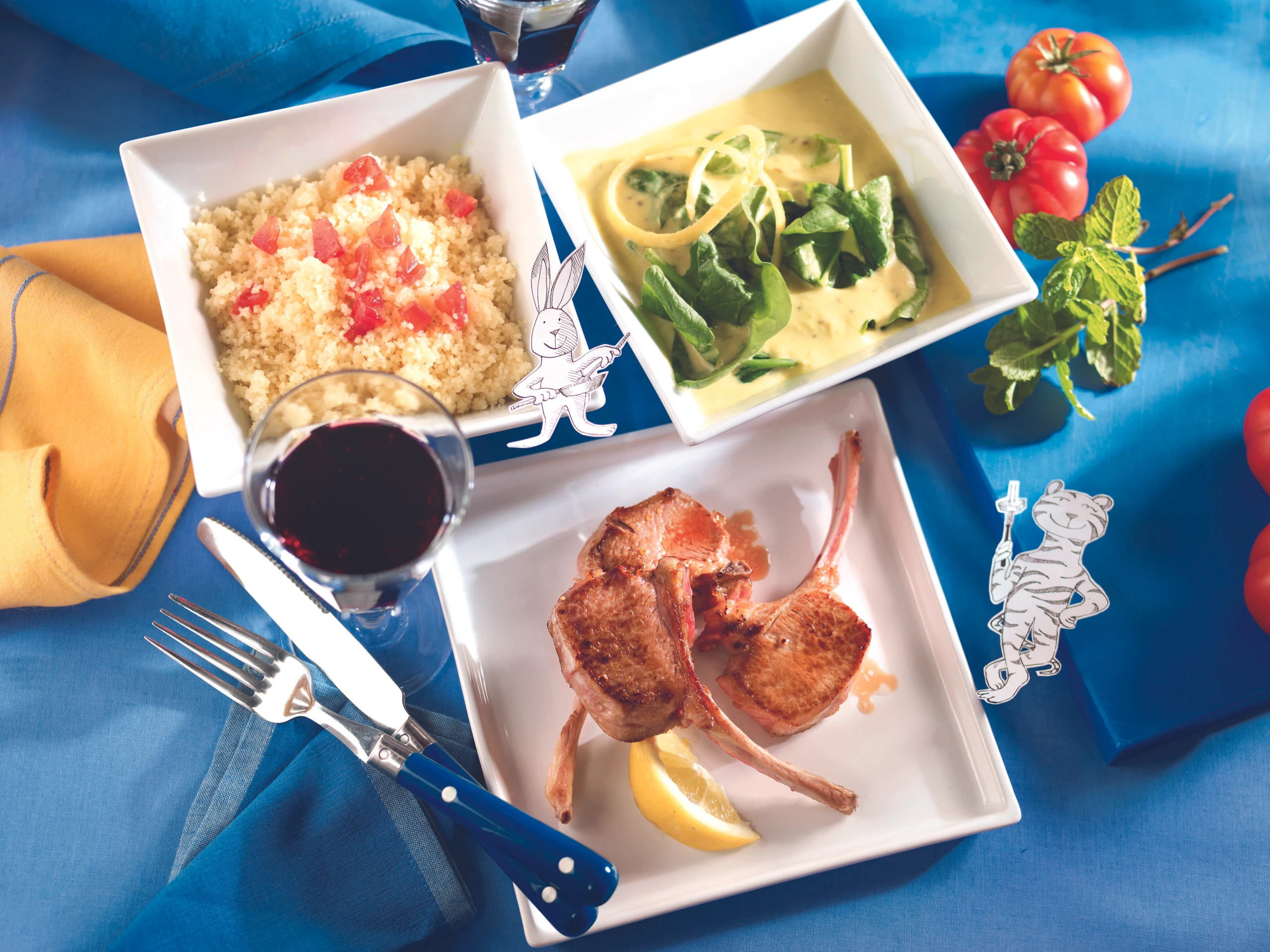 Lammkoteletts mit Curry-Spinat und Paradeiser-Couscous