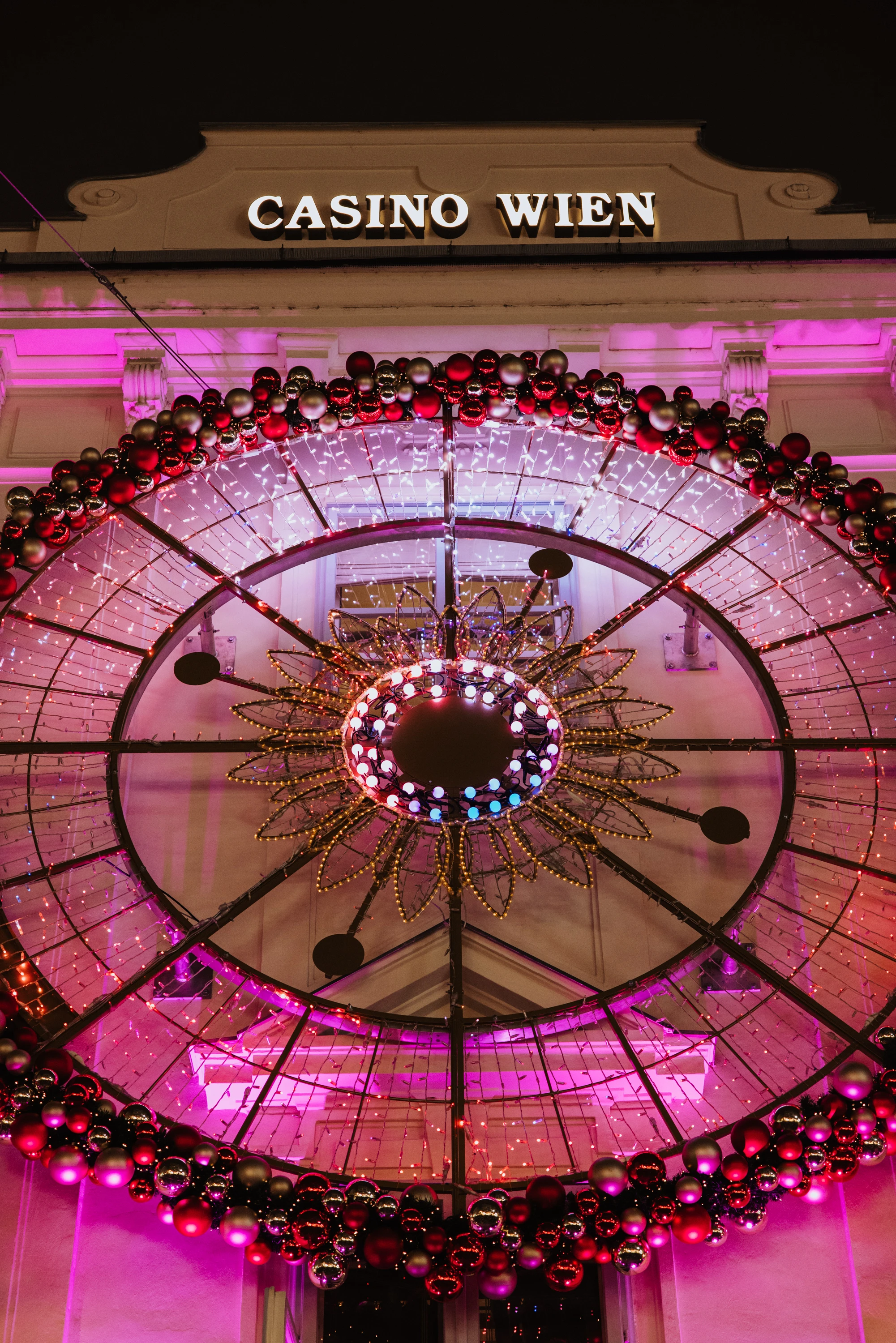 Casino Wien at night with Christmas lights and decorations.