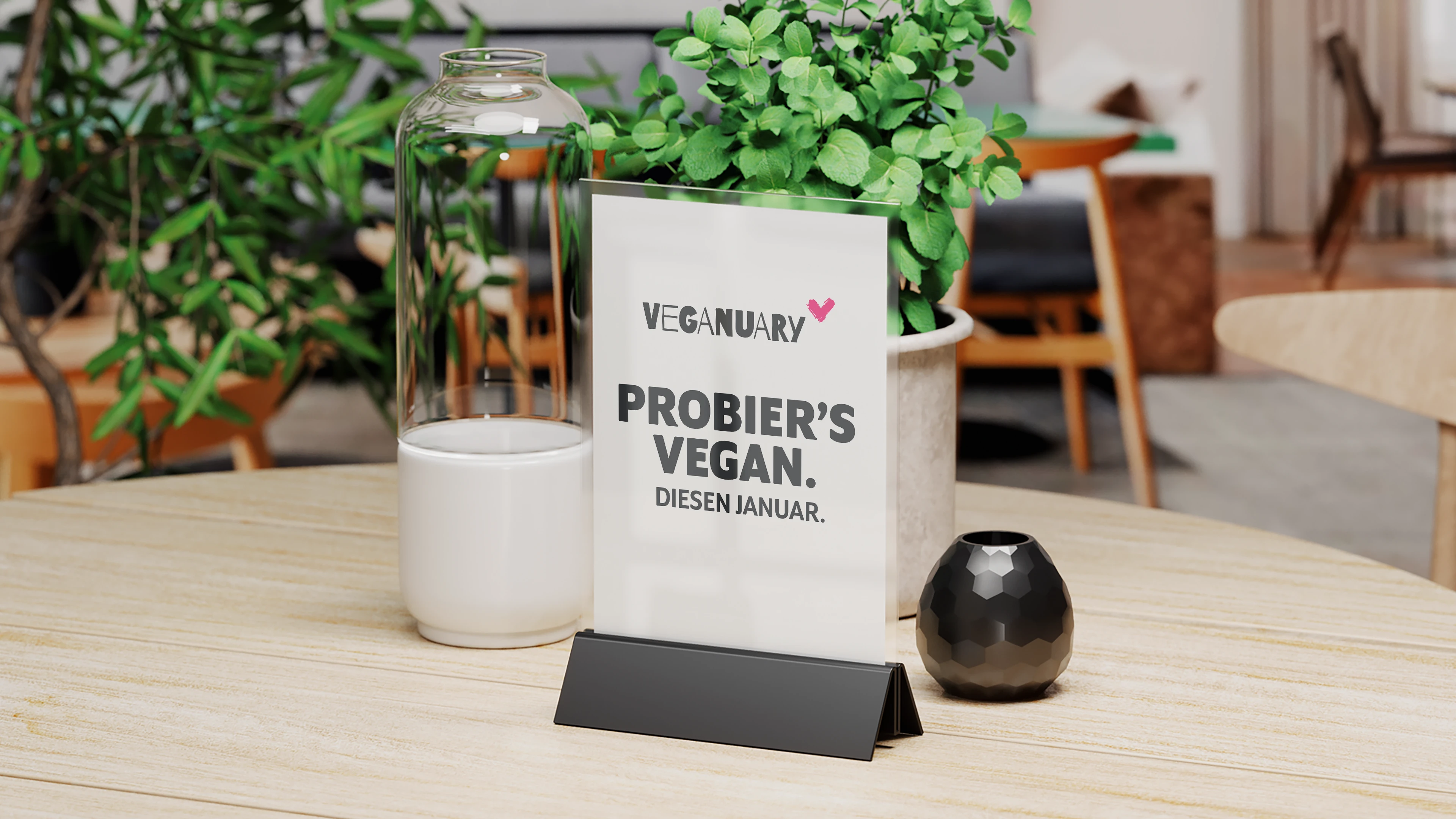 Veganuary: Probier's vegan diesen Januar. Tischdeko mit Botschaft zur veganen Ernährung.