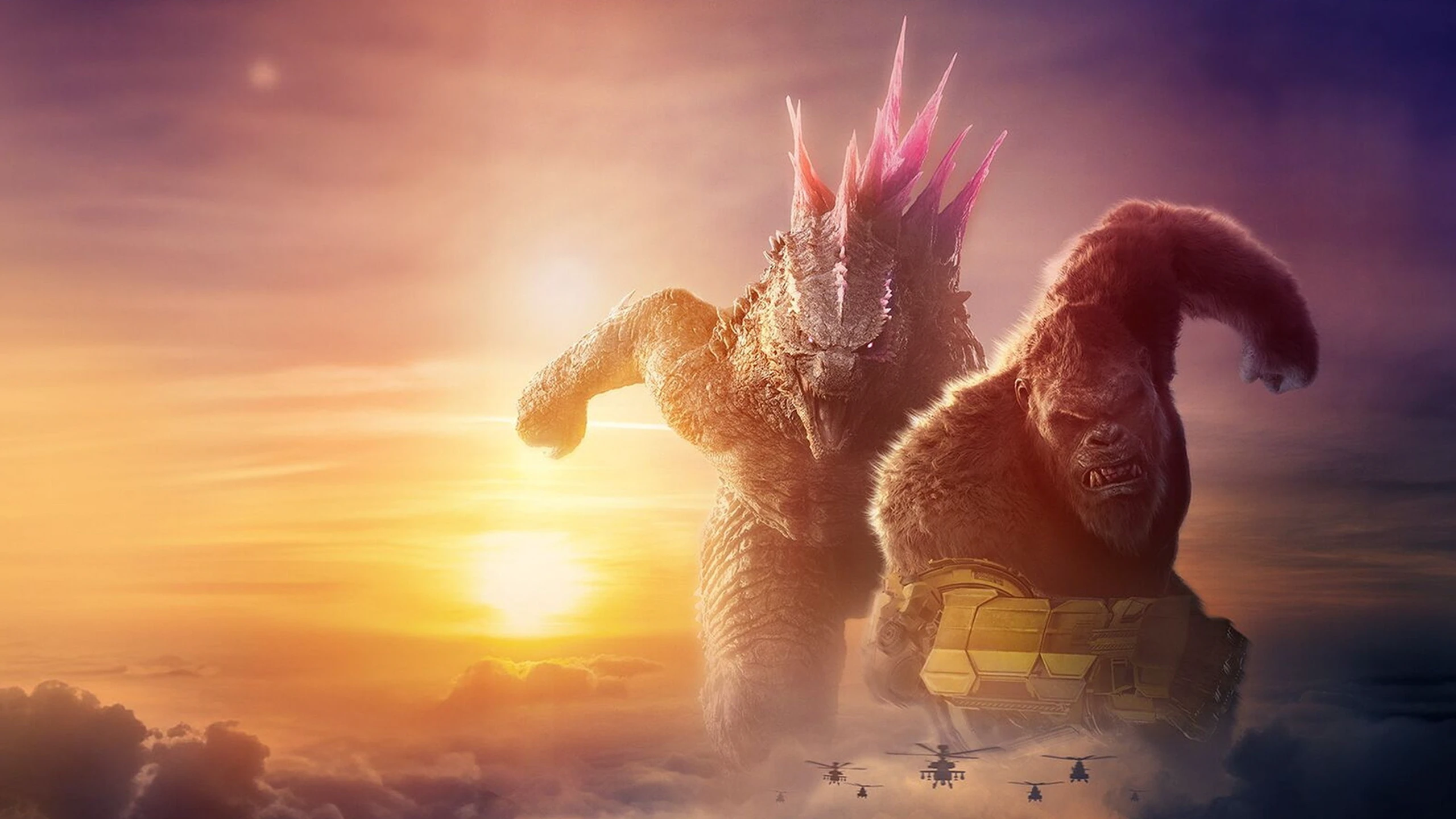 Godzilla und King Kong sind am Horizont zu sehen, während Helikopter auf sie zu fliegen