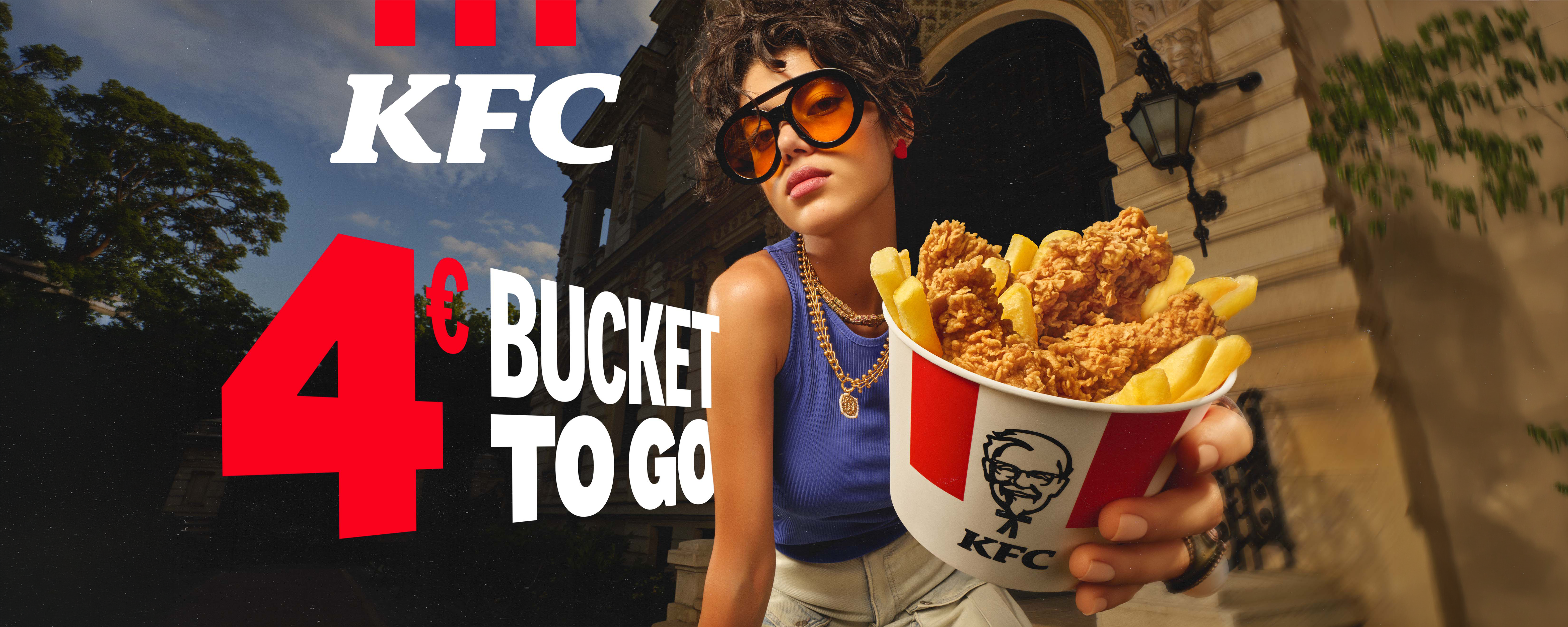 KFC 4€ Bucket to go: Frau mit Chicken-Bucket, Aktionsangebot zum Mitnehmen