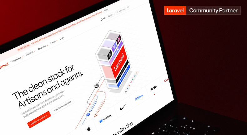 Laptop displaying the Laravel PHP framework website featuring its clean stack design and community partner badge.